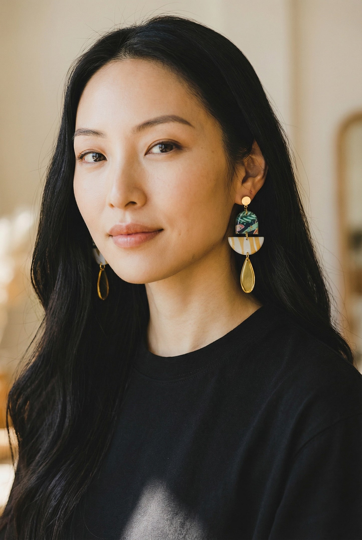 Lakelynns Designs abstract dangle earrings with tropical foliage, gold stripes, and teardrop pendant.