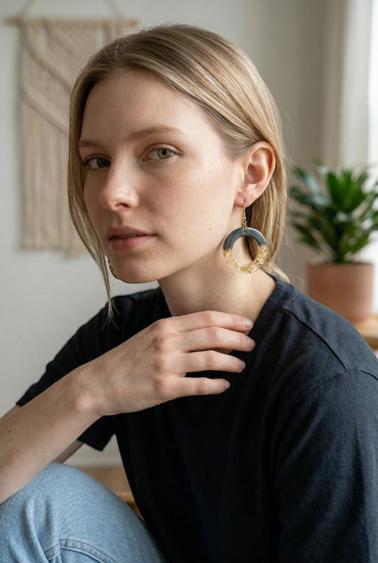 Lakelynns Designs black & gold round hoop earrings with gold flakes in charcoal grey resin. Statement jewelry.