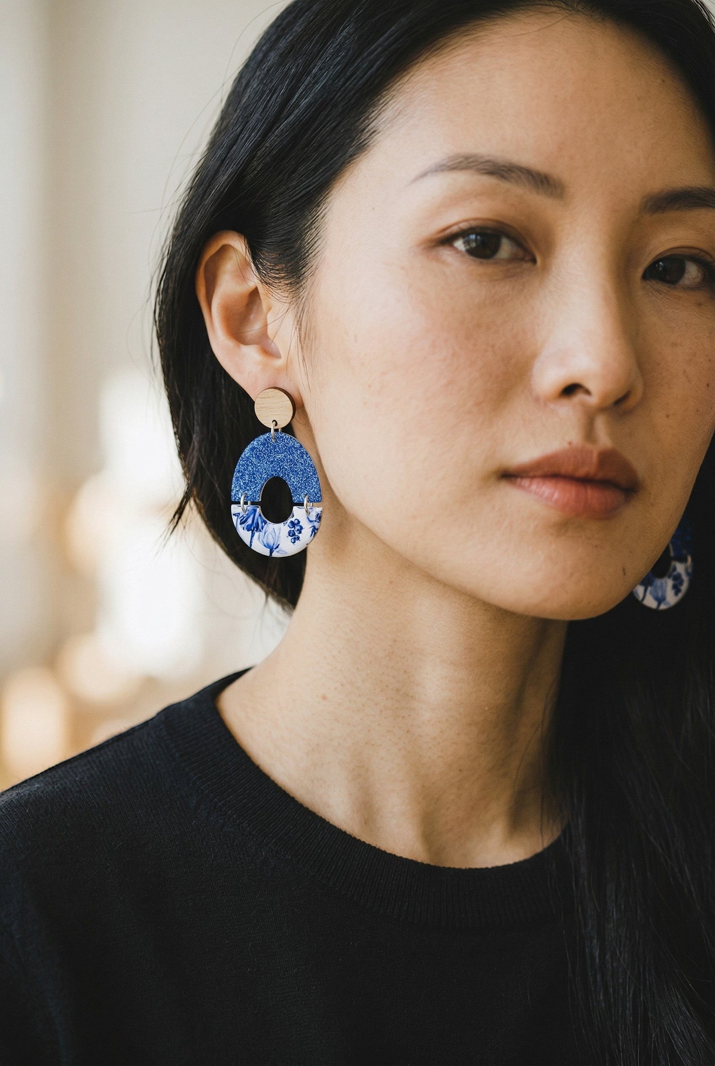 Lakelynns Designs oval blue floral statement earrings with glitter top and wooden stud.