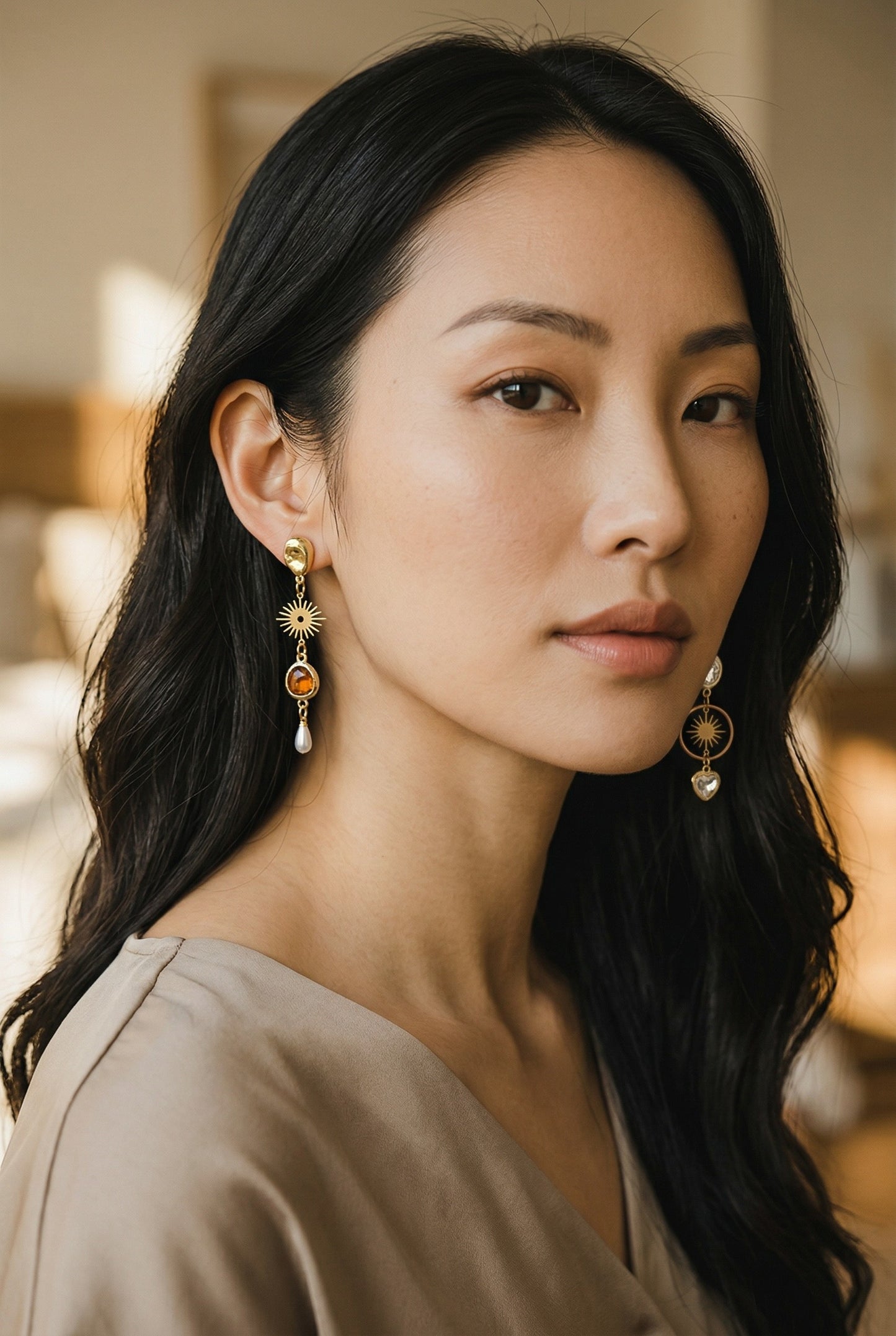 Lakelynns Designs gold-tone dangle earrings with sun, amber gemstone, and pearl charms.