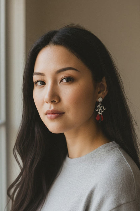 Lakelynns Designs cow print dangle earrings with red teardrop charms and silver-tone studs.
