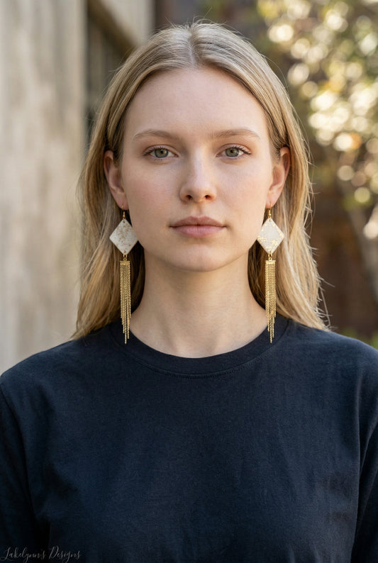 Lakelynns Designs cream and gold diamond-shaped stud earrings with delicate gold chain tassels.