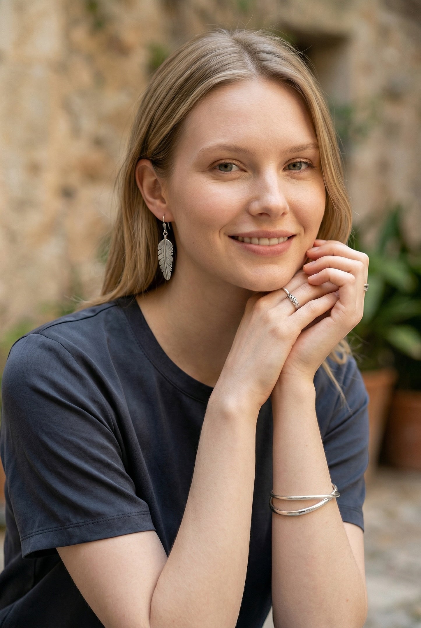 Lakelynns Designs Maren Feather Drop Earrings in silver-tone metal. Lightweight, realistic feather design with secure hooks.
