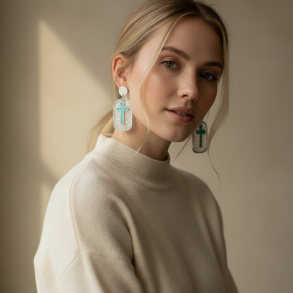 Lakelynns Designs Genevieve earrings: white rectangular acrylic with glitter and turquoise cross detail. Lightweight and stylish.