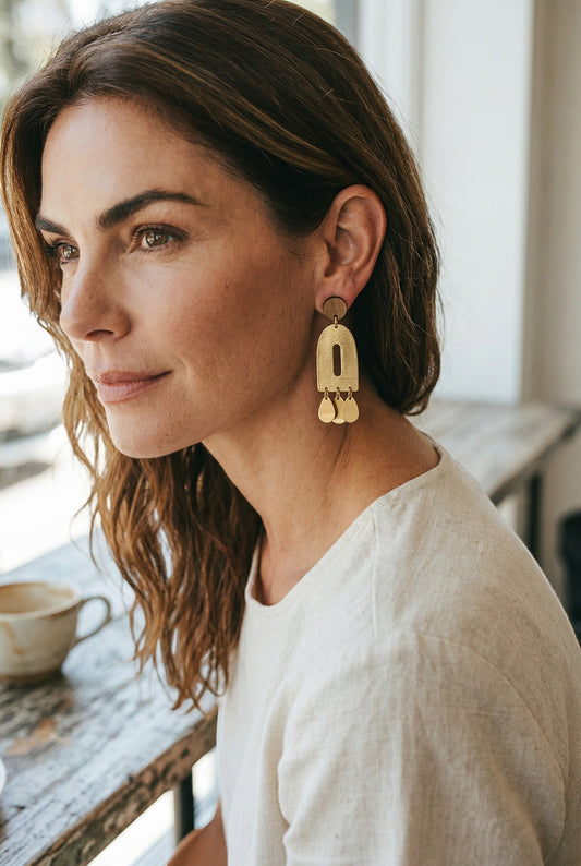 Lakelynns Designs geometric arch dangle earrings with wood accent and brass teardrops.