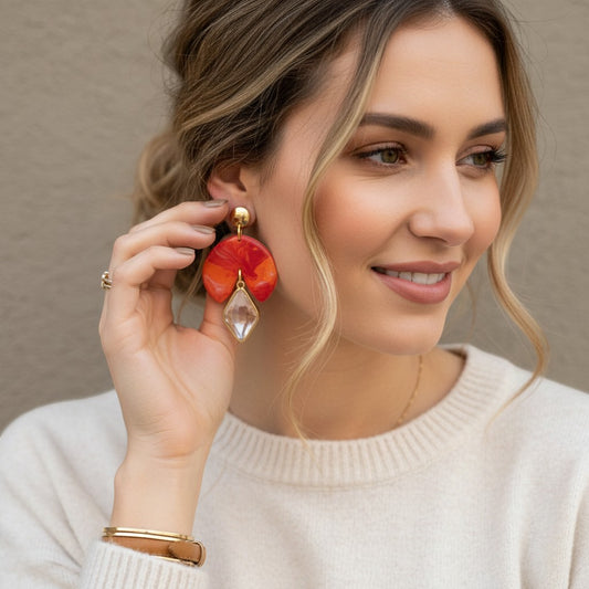 Lakelynns Designs Gracie fan earrings with marbled orange, red, and purple polymer clay and clear gemstone drop.