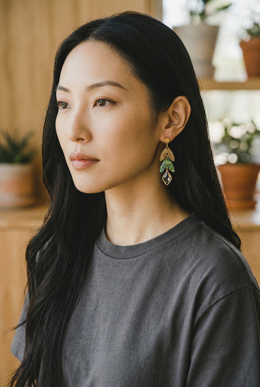 Lakelynns Designs Quinn Dangle Leaf Earrings with gold glitter top leaf, green and teal glitter leaves, and clear faceted charm.
