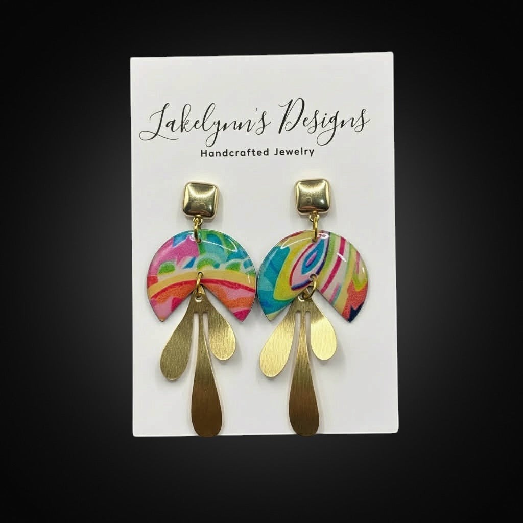 Lakelynns Designs abstract dangle earrings with colorful swirls and brass-toned leaves.