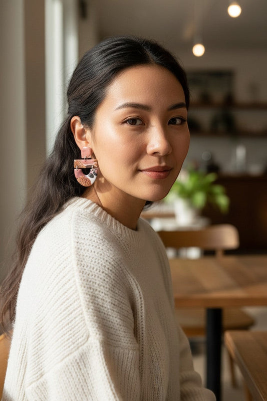 Lakelynns Designs abstract pattern dangle earrings in blush pink, brown, black, and orange. Lightweight statement jewelry.