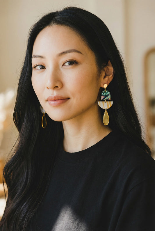 Lakelynns Designs abstract dangle earrings with tropical foliage, gold stripes, and teardrop pendant.