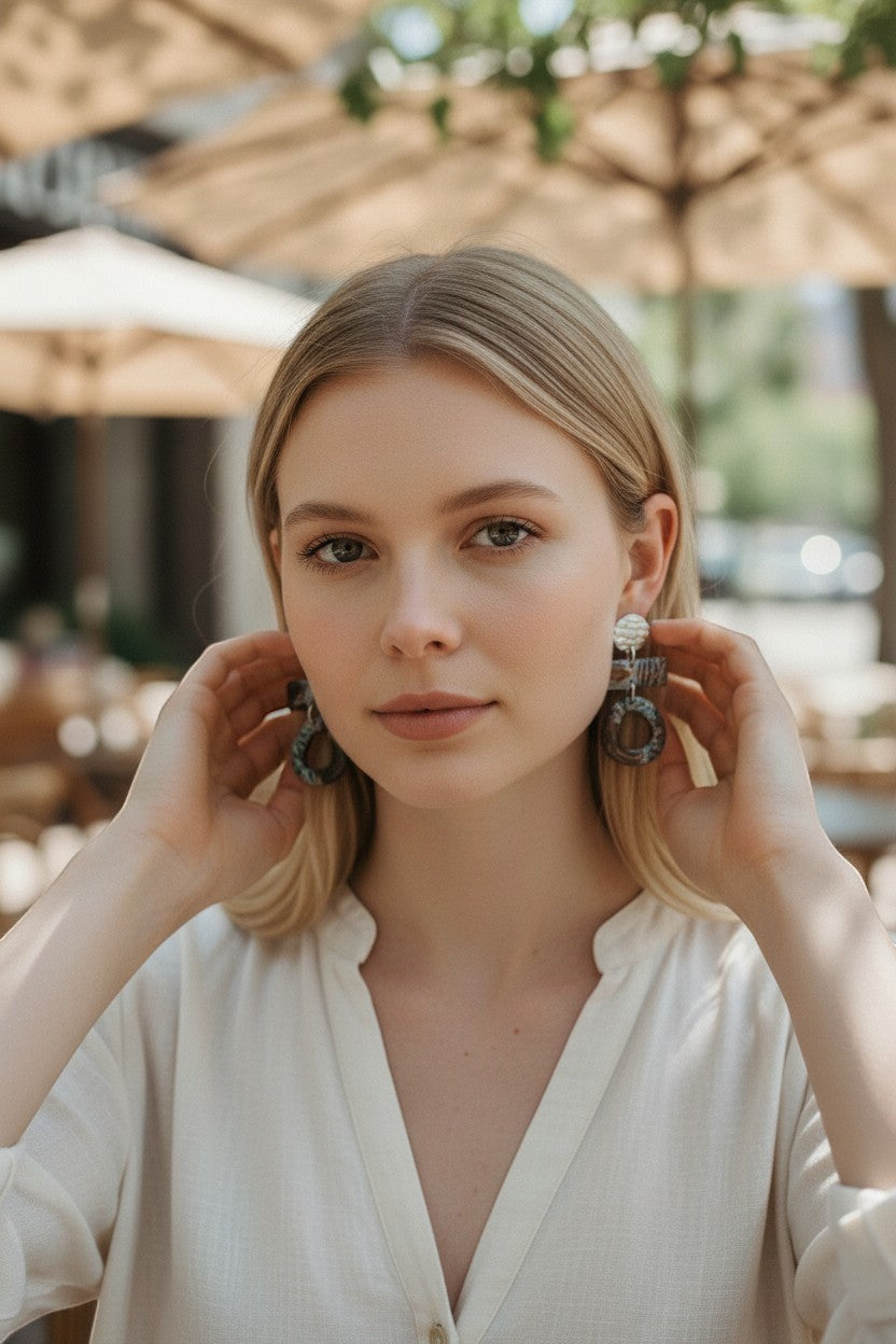 Lakelynns Designs abstract geometric dangle earrings with marbled brown and teal patterns and silver-tone disc.
