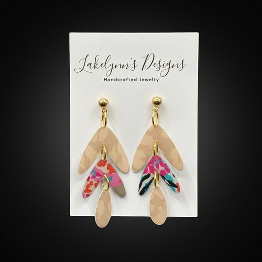Lakelynns Designs abstract leaf dangle earrings with neutral and floral pink, teal, coral accents. Lightweight for all-day wear.