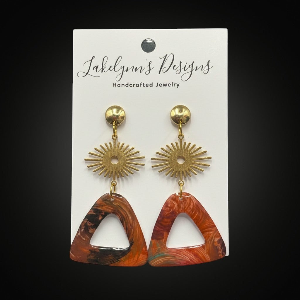 Lakelynns Designs abstract triangle dangle earrings with sunburst accents in warm earth tones.
