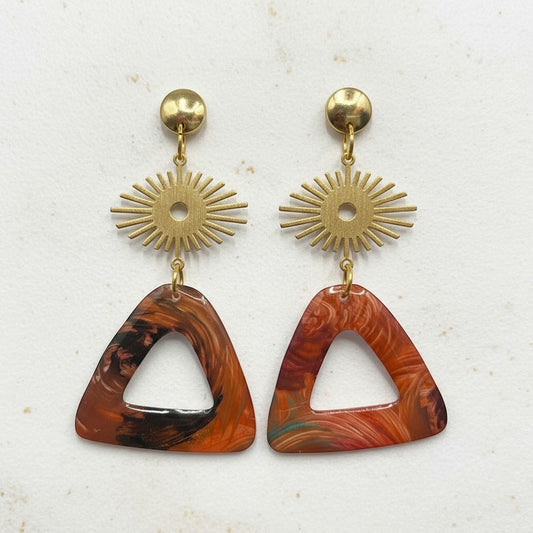 Lakelynns Designs abstract triangle dangle earrings with gold-tone sunburst accents in warm earth tones.