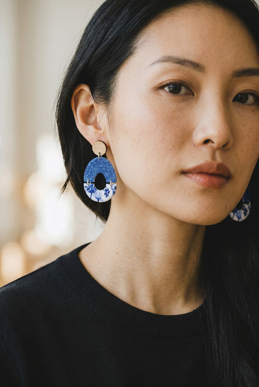 Lakelynns Designs oval blue floral statement earrings with glitter top and wooden stud.