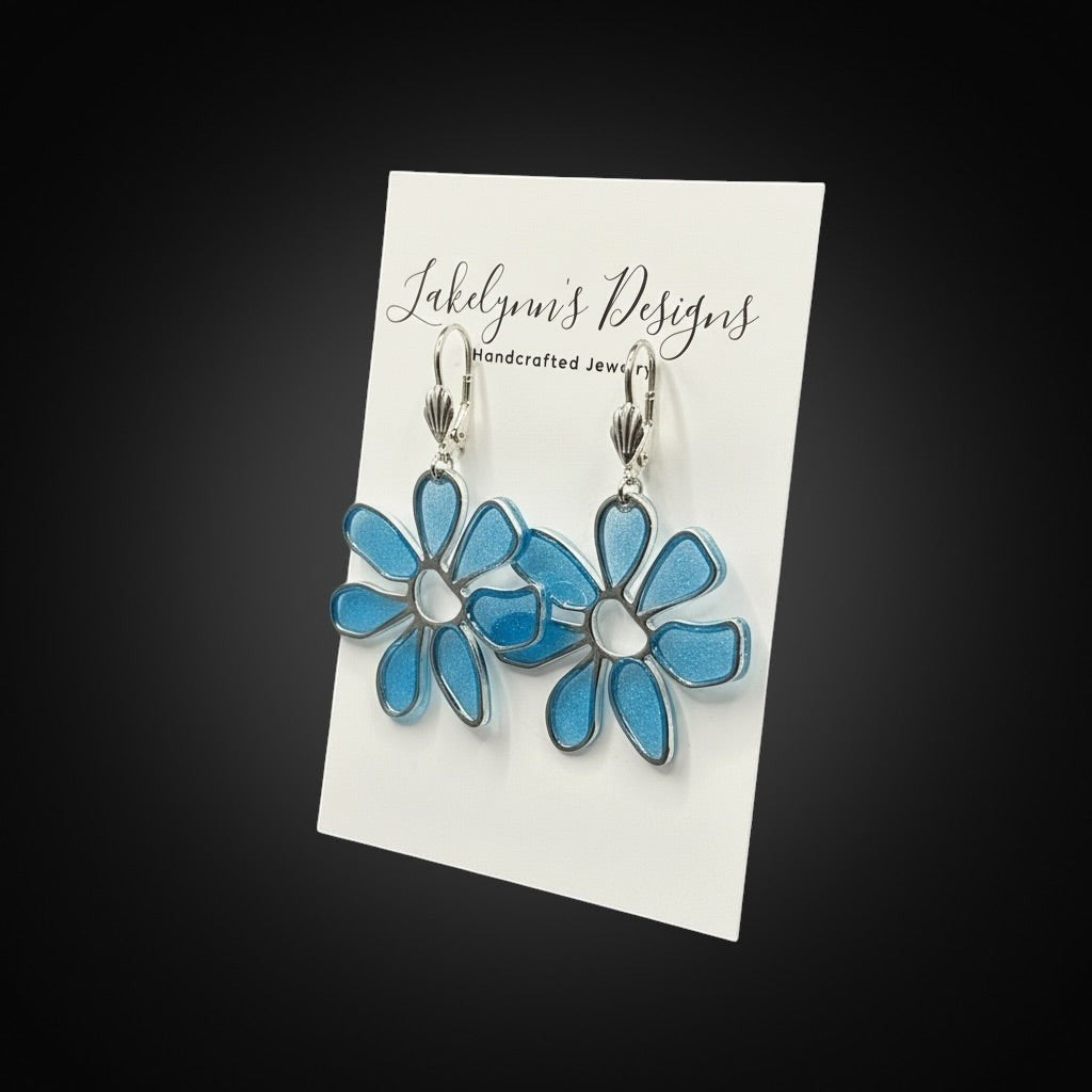 Lakelynns Designs blue flower dangle earrings with silver-tone outlines and lever-back closures.