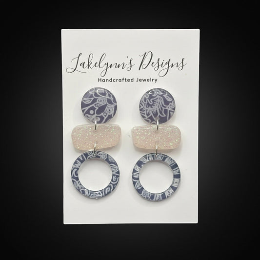 Lakelynns Designs abstract geometric statement earrings with navy & white pattern circles and pastel glitter rectangles.