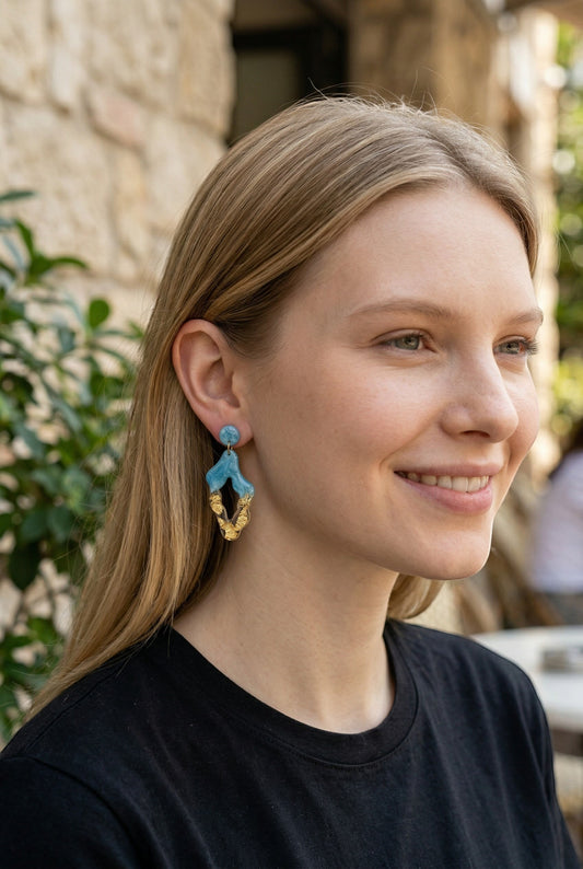 Lakelynns Designs abstract geometric dangle earrings in blue resin with gold flakes. Modern, lightweight statement jewelry.