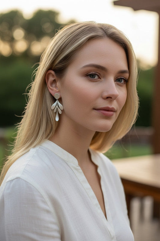Lakelynns Designs brushed metal leaf drop earrings with a matte finish, featuring a delicate leaf design.