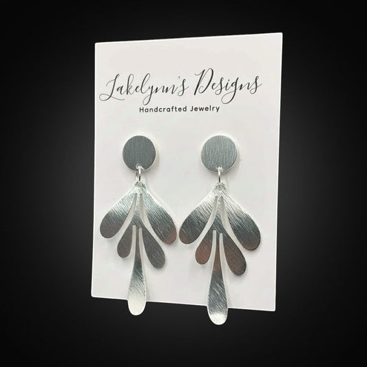 Lakelynns Designs brushed metal leaf drop earrings with a matte finish and nature-inspired design.