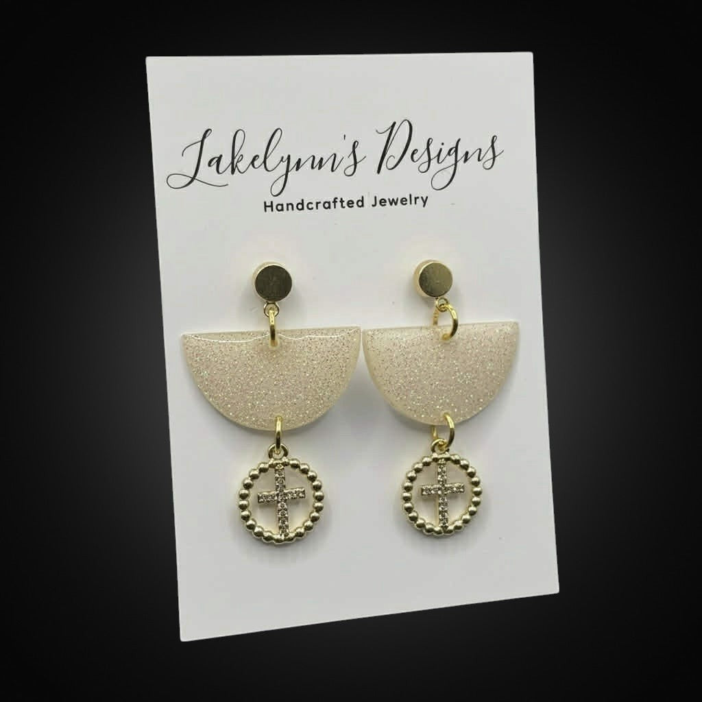 Lakelynns Designs champagne glitter semi-circle earrings with gold-tone cross charm dangle.