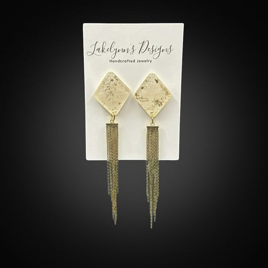 Lakelynns Designs cream and gold diamond-shaped stud earrings with delicate gold chain tassels.