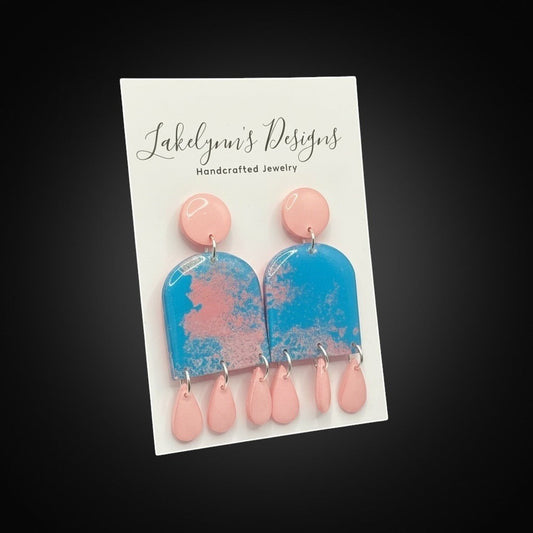 Lakelynns Designs Emberly earrings: blue and pink marbled arch dangles with pink teardrop charms.