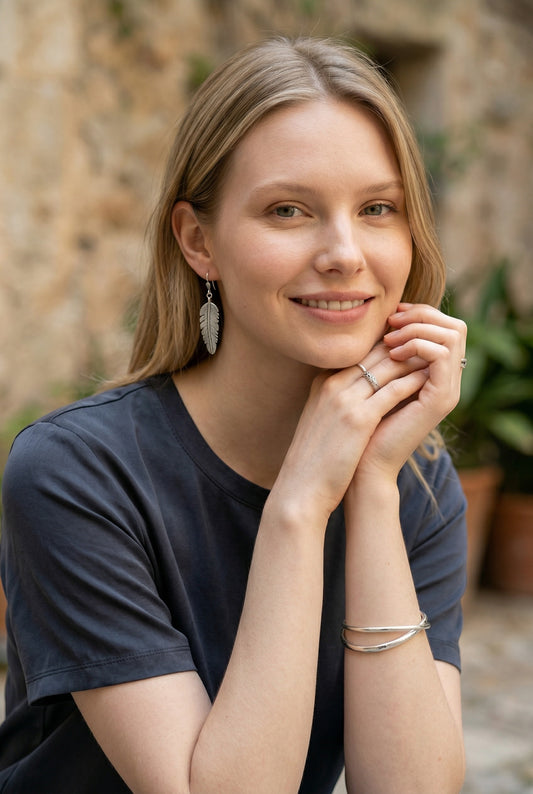 Lakelynns Designs Maren Feather Drop Earrings in silver-tone metal. Lightweight, realistic feather design with secure hooks.