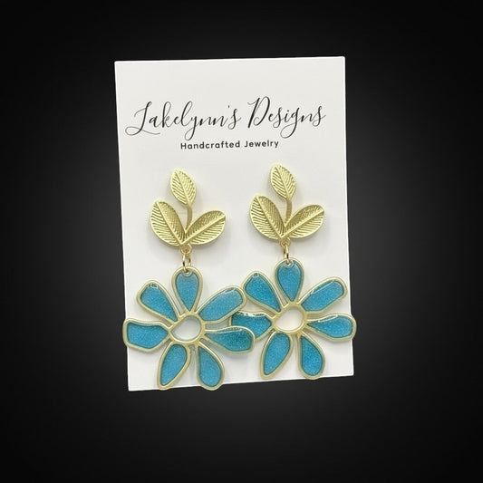 Lakelynns Designs gold-toned leaf and turquoise floral resin dangle earrings.