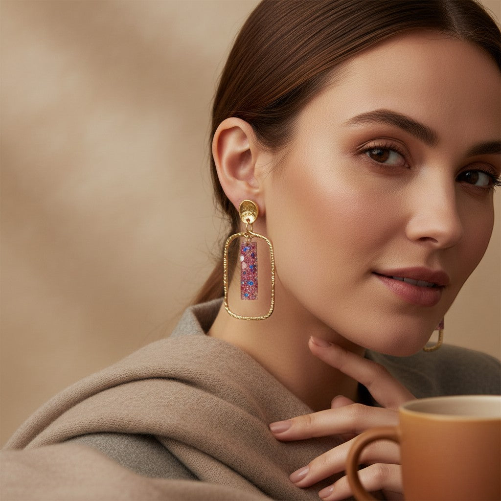 Lakelynns Designs gold frame earrings with pink, blue, and iridescent glitter bars suspended within. Modern abstract design.