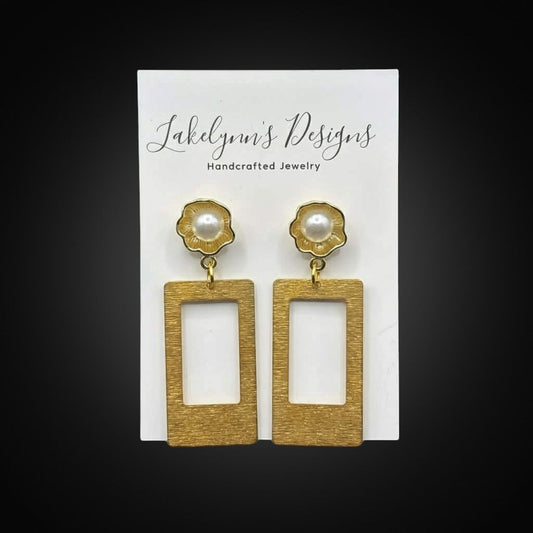 Lakelynns Designs gold rectangular frame earrings with pearl accents resembling flowers. Brushed gold finish.