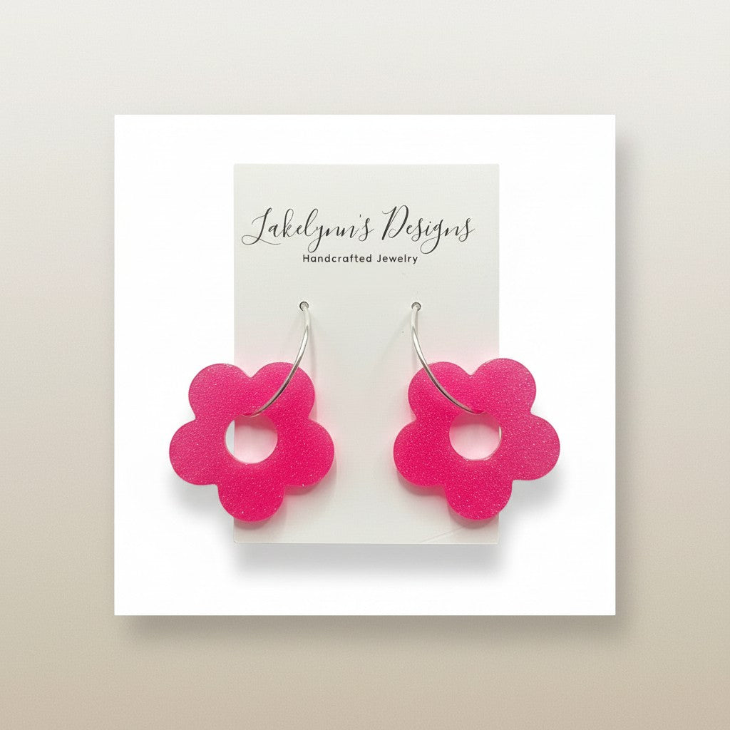 Lakelynns Designs hot pink acrylic flower hoop earrings with a retro-inspired shape.