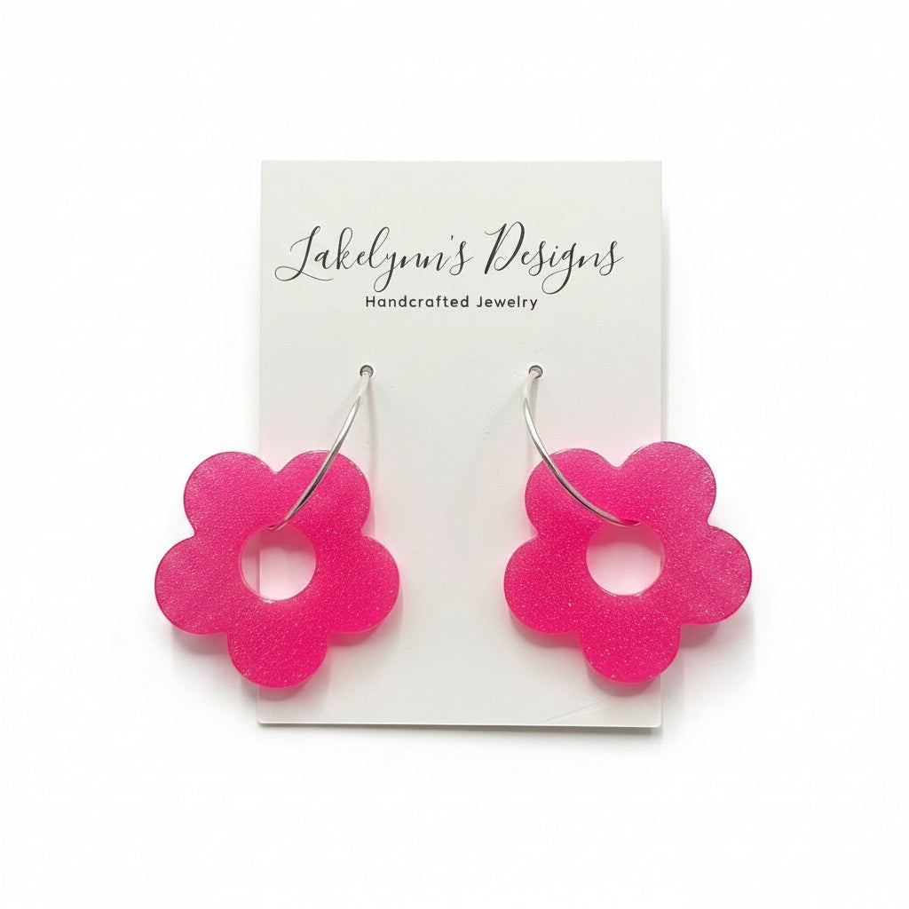 Lakelynns Designs hot pink acrylic flower hoop earrings with a retro-inspired shape.