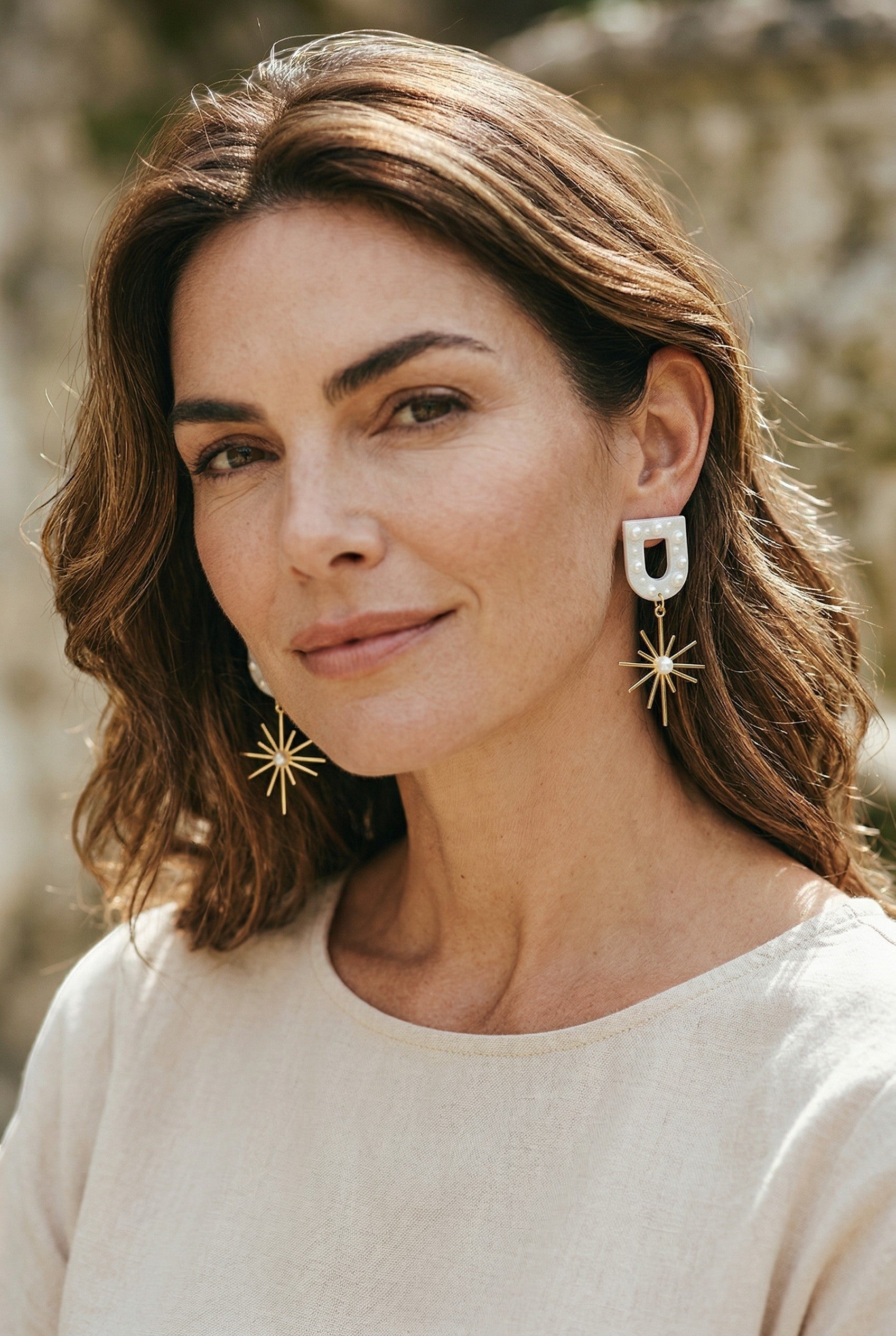 Lakelynns Designs Kendall Starburst Arch Earrings with faux pearls and gold-tone starburst charm.