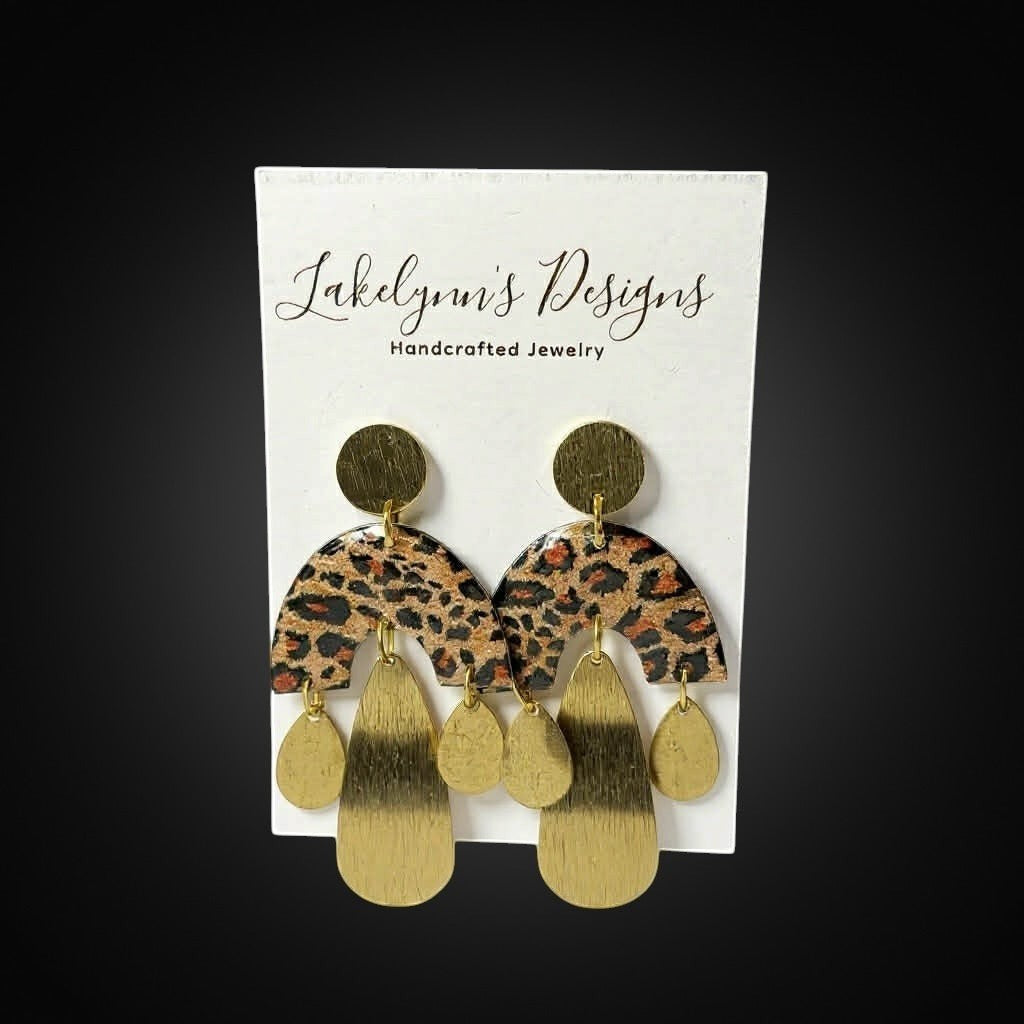 Lakelynns Designs Liv Leopard Print Arch Dangle Earrings with gold teardrop charms. Statement earrings.
