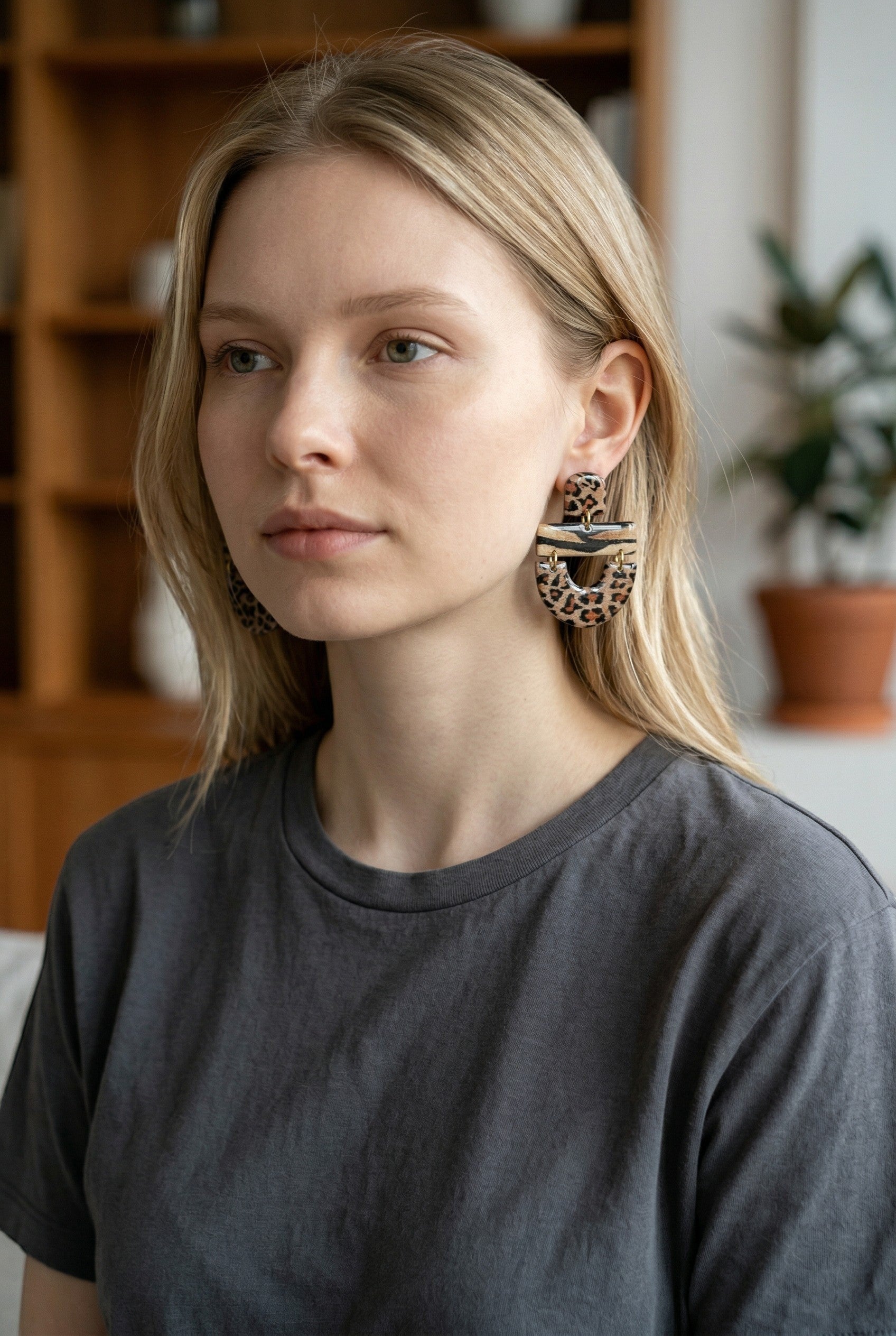 Lakelynns Designs statement earrings with leopard print and layered design, featuring a rectangular top and curved drop.
