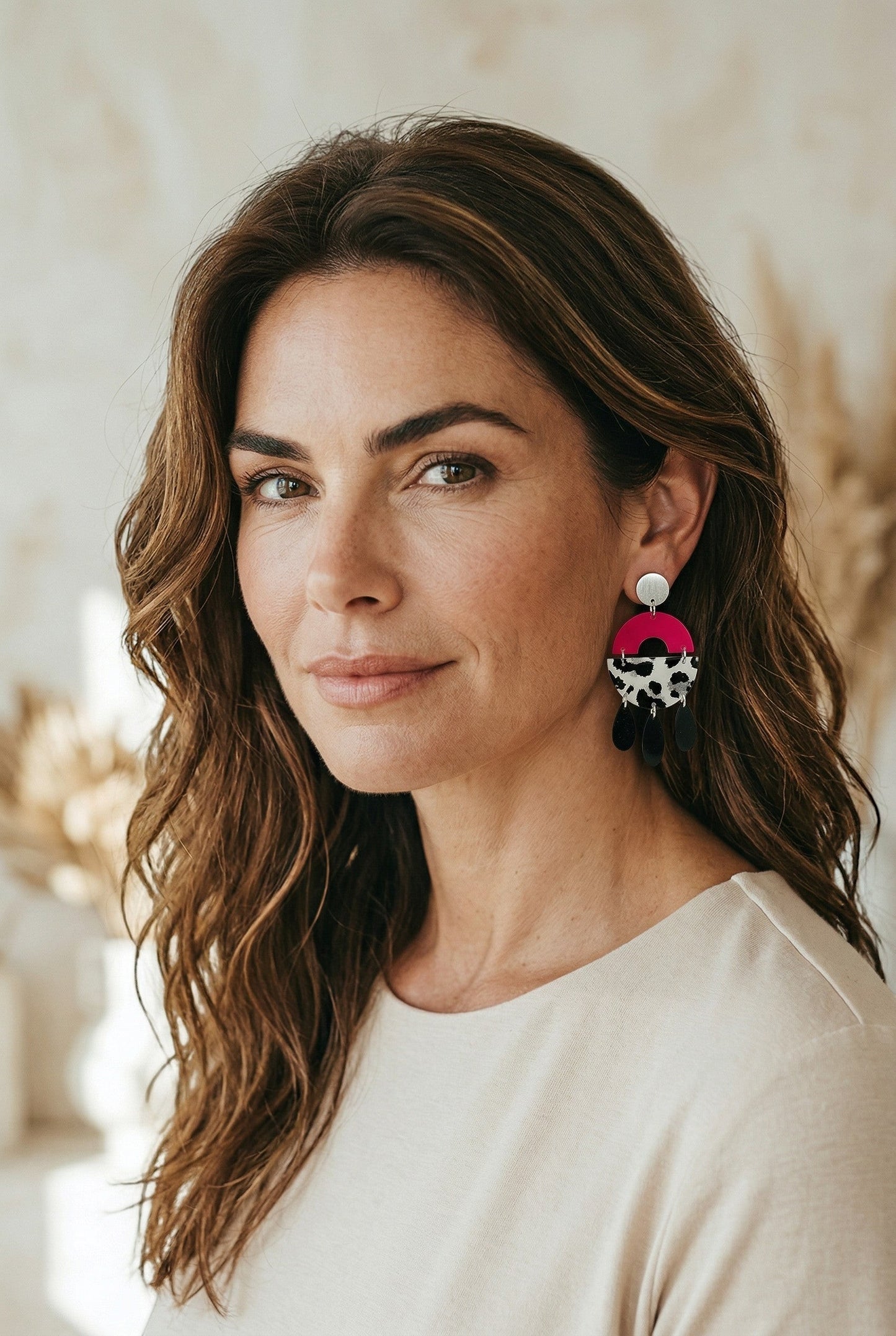 Lakelynns Designs Maya abstract dangle earrings: hot pink semi-circle, cow print acrylic, black teardrops, silver stud.