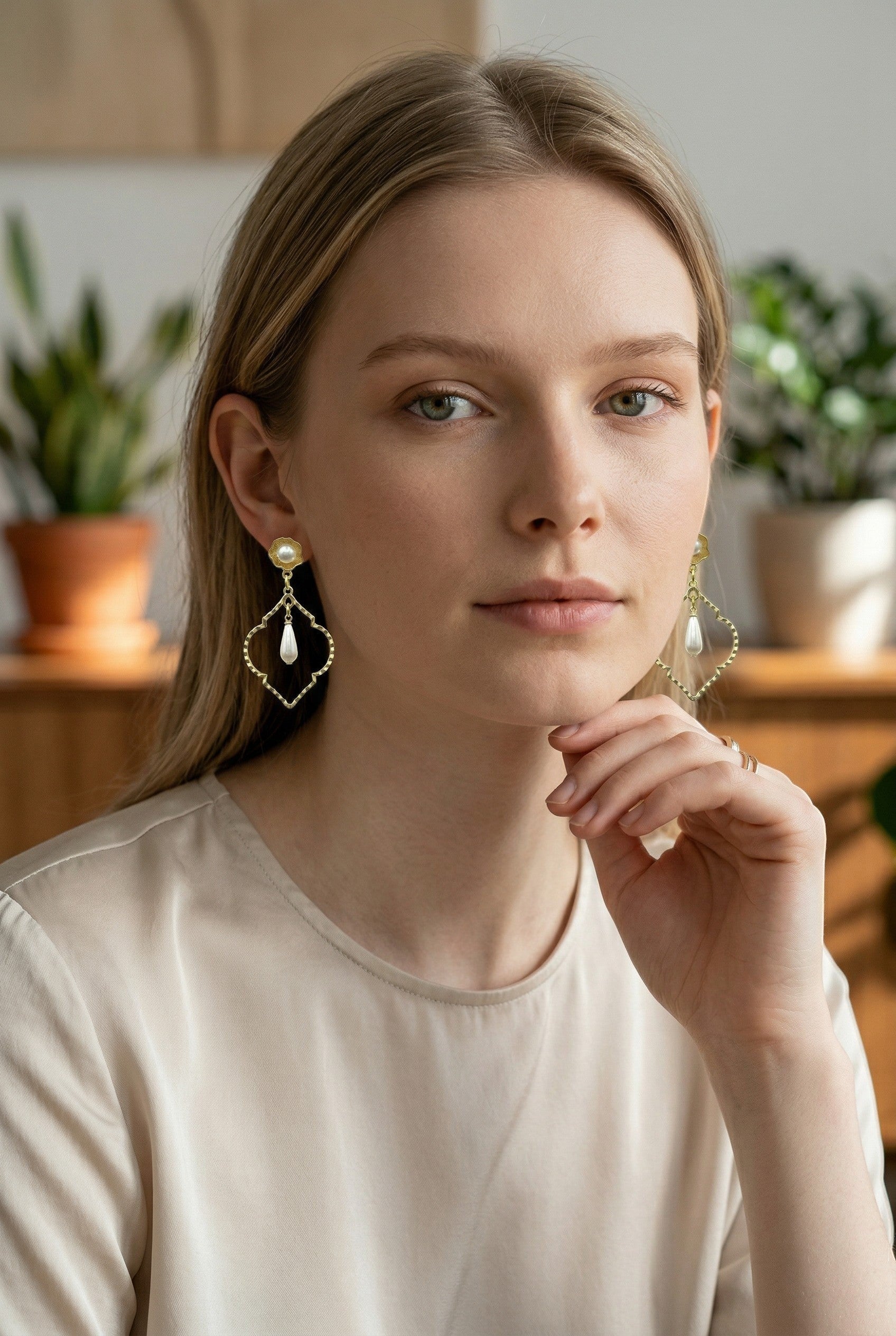 Lakelynns Designs ornate gold-tone drop earrings with faux pearls, featuring a floral stud and teardrop pearl.