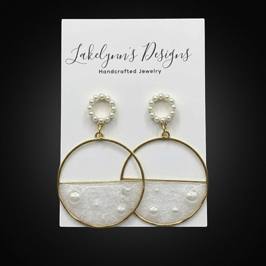 Lakelynns Designs gold-tone hoop dangle earrings with white resin and faux pearls. Circular stud tops.