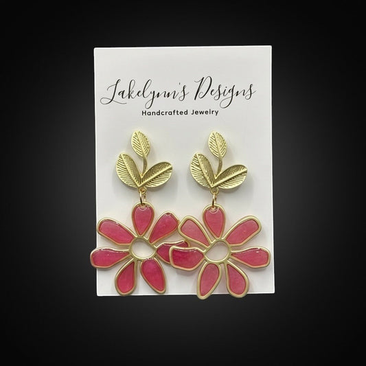 Lakelynns Designs fuchsia pink floral leaf dangle earrings with gold-tone accents and translucent resin petals.