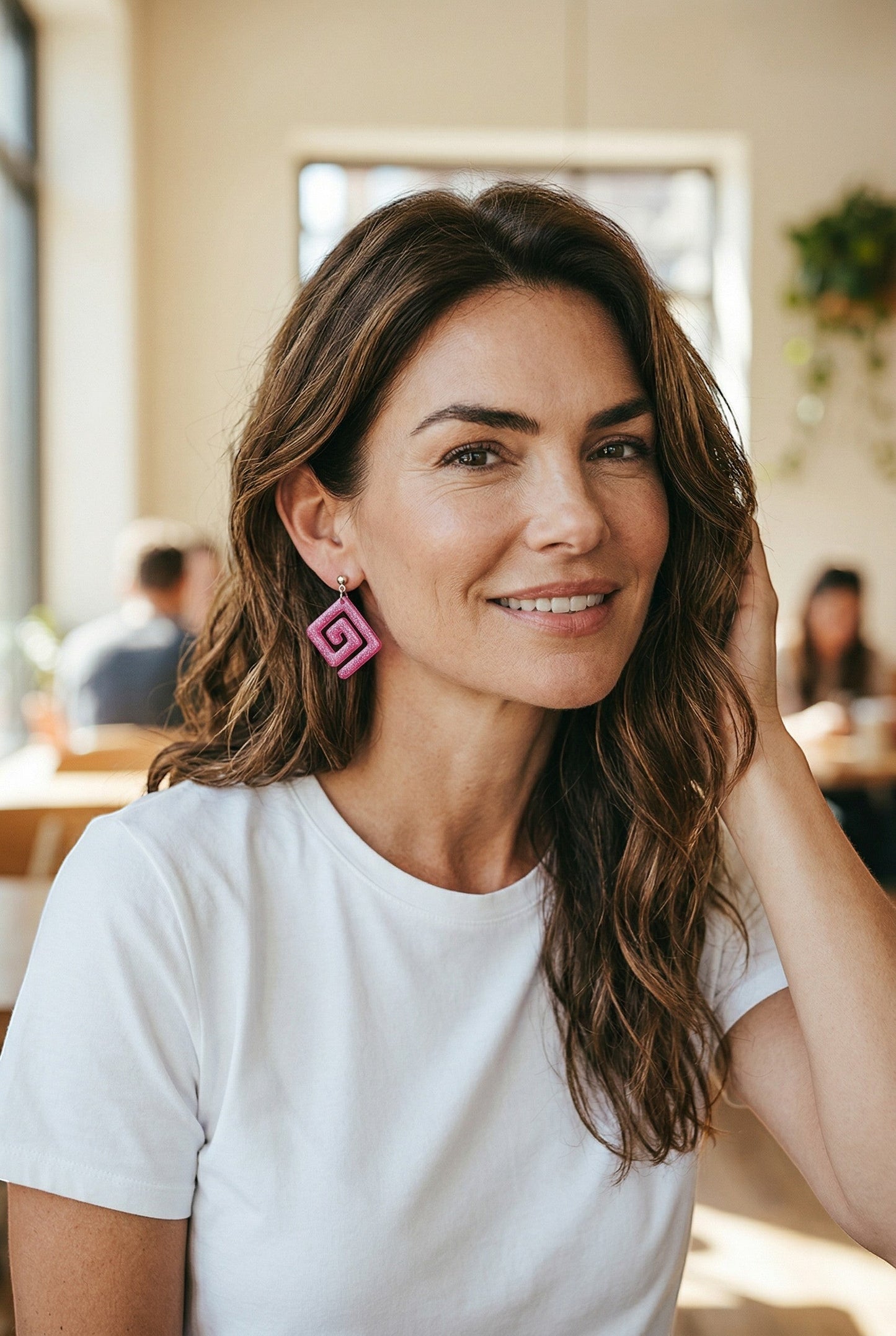 Lakelynns Designs pink glitter resin geometric spiral dangle earrings in diamond shape.