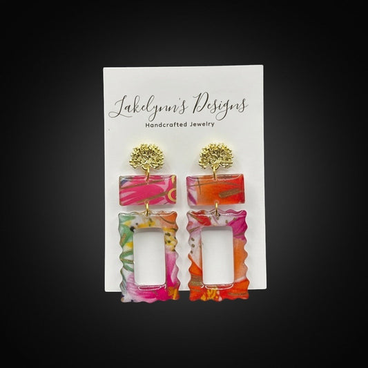 Lakelynns Designs Rectangular Statement Earrings with gold-tone stud tops, featuring vibrant pink, orange, and green patterns on a translucent background.