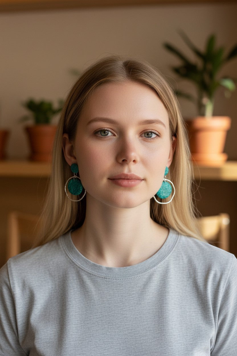 Lakelynns Designs teal embossed polymer clay hoop earrings with silver-tone hoops.