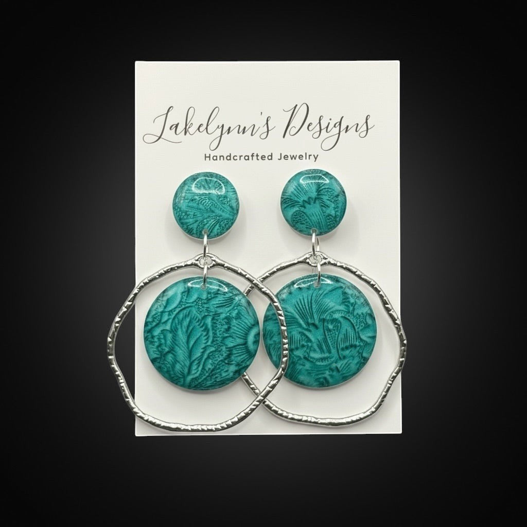 Lakelynns Designs teal embossed polymer clay hoop earrings with silver-tone hoops.