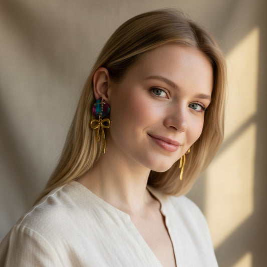 Lakelynns Designs Teardrop Bow Earrings with abstract teal, magenta, gold stud and hammered gold bow.