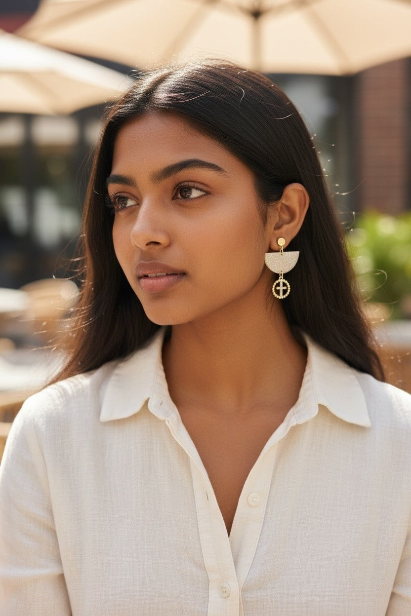 Lakelynns Designs Trudy Glitter Dangle Earrings with gold-tone cross charm, champagne glitter top, and gold bead detail.