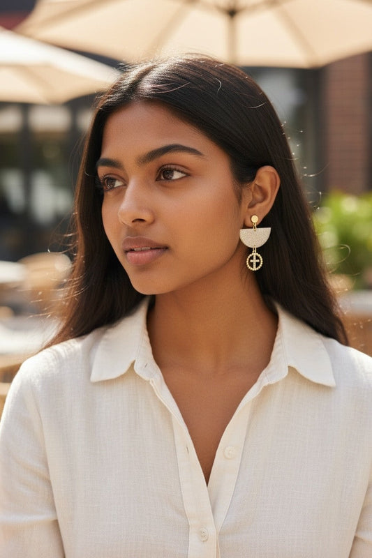 Lakelynns Designs Trudy Glitter Dangle Earrings with gold-tone cross charm, champagne glitter top, and gold bead detail.