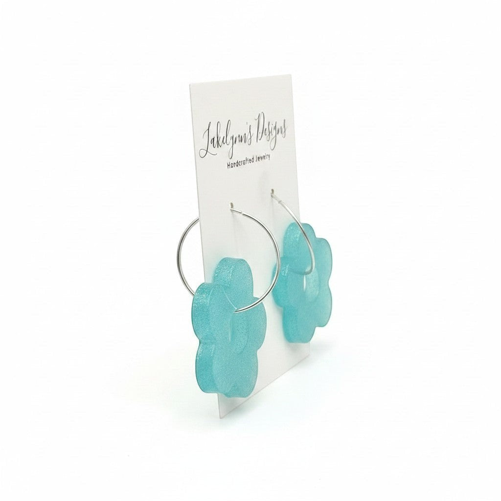 Lakelynns Designs turquoise flower hoop earrings with a retro floral design and shimmering finish.