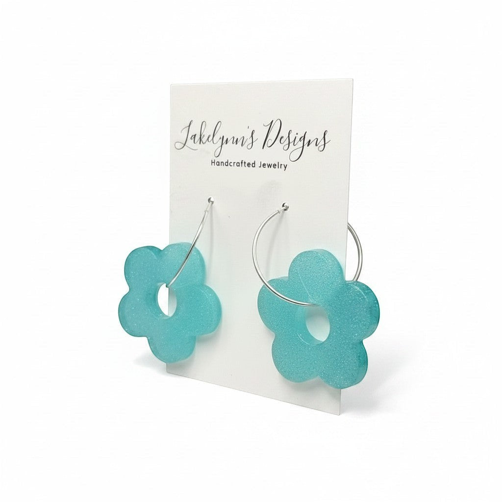 Lakelynns Designs turquoise flower hoop earrings with a shimmering finish and retro floral design.