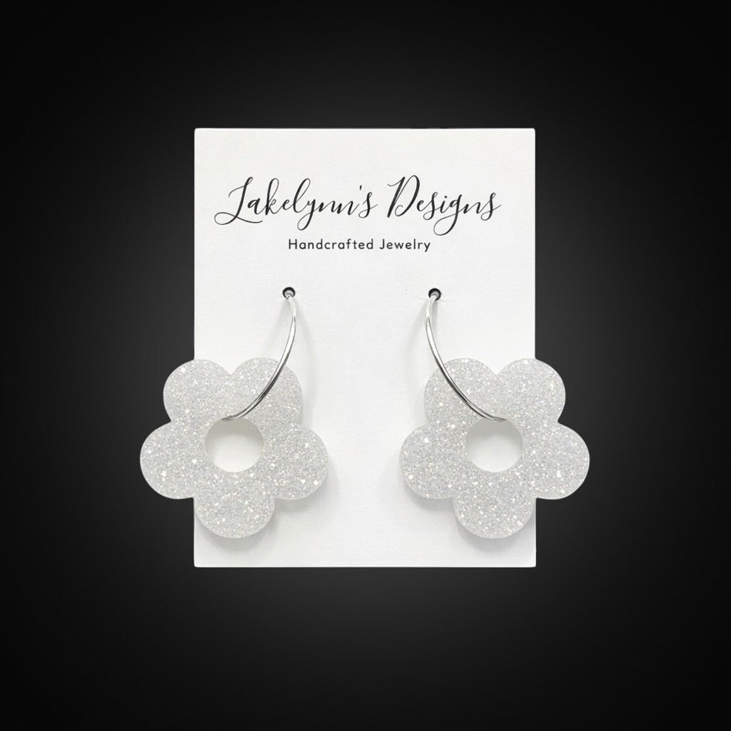Lakelynns Designs white glitter acrylic flower hoop earrings with silver-tone hoops.